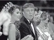  ?? FILE/THE TIMES ?? Donald Trump talks with Miss USA 1996 Ali Landry during the 1997 Miss USA pageant in Shreveport.