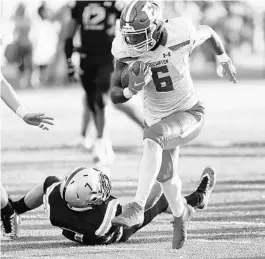  ?? STEPHEN M. DOWELL/ORLANDO SENTINEL ?? Edgewater’s Christian Leary eludes Bishop Moore defenders in a win for the Eagles last season. After two weeks without a game due to positive COVID-19 tests Edgewater returned to the field to play another Orlando area power, Kissimmee Osceola, on Friday.