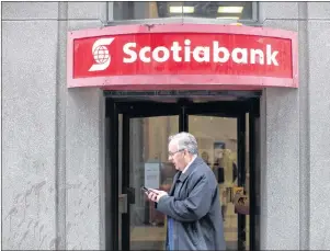  ?? CP PHOTO ?? A branch of Scotiabank is pictured in downtown Toronto on Tuesday.