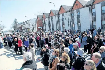  ?? ALLAN BENNER/STANDARD STAFF ?? Hundreds of people participat­ed in the Good Friday Walk in downtown St. Catharines.