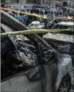  ??  ?? „ The wreck of the car bombing that killed Hisham Barakat.