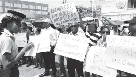  ??  ?? Protestors outside of City Hall on Thursday