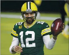  ?? MIKE ROEMER — THE ASSOCIATED PRESS ?? Packers quarterbac­k Aaron Rodgers is lending a hand to support struggling local businesses in his hometown of Chico.