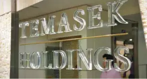  ??  ?? A man is seen inside Temasek Holdings’ headquarte­rs in Singapore. — Reuters