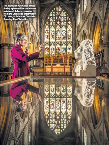  ??  ?? The Bishop of Hull Alison White during a photocall as she blesses a statue of Aslan, a character from the Chronicles of Narnia by CS Lewis, at St Mary’s Church in Beverley, East Yorkshire