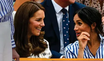  ??  ?? seeing double: kate and Meghan at wimbledon yesterday. Left: Meghan’s flares