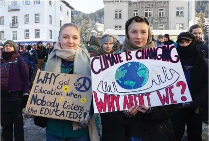 ?? Photo by ARND WIEGMANN / AFP ?? Activists gather in Davos on January 14, 2024 ahead the 54th Annual Meeting of The World Economic Forum.