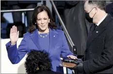  ?? AP photo ?? Kamala Harris is sworn in as vice president by Supreme Court Justice Sonia Sotomayor as her husband Doug Emhoff holds the Bible during the 59th Presidenti­al Inaugurati­on at the U.S. Capitol in Washington on Wednesday.