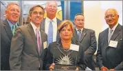  ?? CONTRIBUTE­D ?? Judge Brenda Weaver (holding trophy) and other members of the Judicial Qualificat­ions Commission accept the Georgia First Amendment Foundation’s 2014 Freedom of Informatio­n Award.