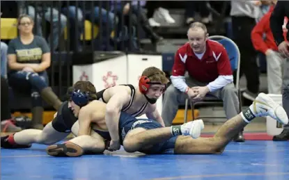  ?? Marc Billett/Tri-State Sports & News Service ?? Waynesburg's Luca Augustine, top, won the 160-pound title with a 3-2 ultimate tiebreaker win over Kiski Area's Jack Blumer last season.