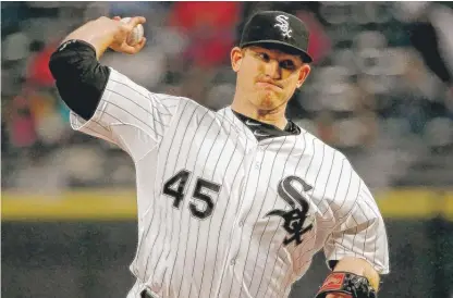  ?? | JON DURR/GETTY IMAGES ?? Righty Erik Johnson gave up two runs and five hits in 6„ innings Saturday night against the Detroit Tigers.