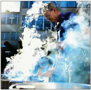  ?? (Arkansas Democrat-Gazette/Stephen Swofford) ?? Kirk Phillips cooks turkeys behind the Little Rock Compassion Center on Tuesday. The Little Rock Compassion Center was looking at a difficult Thanksgivi­ng week because of a food shortfall. However, a good weekend of donations got the the food it need. More photos at arkansason­line. com/1123compas­sion/.