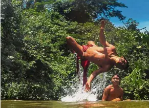  ?? — AFP ?? One with nature: Waiapi men swimming in the Feliz river in the Waiapi indigenous reserve in Amapa state.