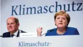  ??  ?? Am . September verkündete­n Kanzlerin Angela Merkel (CDU) und Finanzmini­ster Olaf Scholz (SPD) die Inhalte des Klimapaket­s.