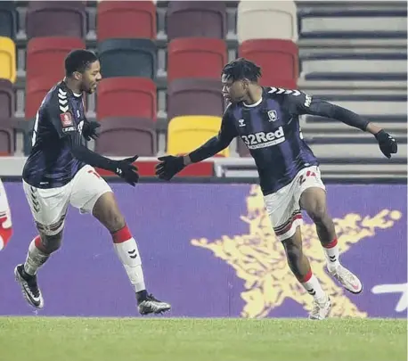  ??  ?? Sam Folarin celebrates his goal with Chuba Akpom.