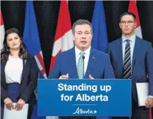  ?? GOVERNMENT OF ALBERTA ?? Alberta Premier Jason Kenney, with MLA Michaela Glasgo and Justice Minister Doug Schweitzer, announces new initiative­s to improve firearms governance and enforcemen­t, in Edmonton on Wednesday.