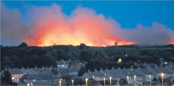  ??  ?? DRAMA: Fires have torn across several patches of grassland with emergency services banding together to launch a huge investigat­ion into their possible cause