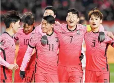  ?? — AFP photo ?? South Korea’s Hwang Hee-chan (third right) celebrates his goal with teammate Son Heung-min (second right) against the United Arab Emirates in Goyang.