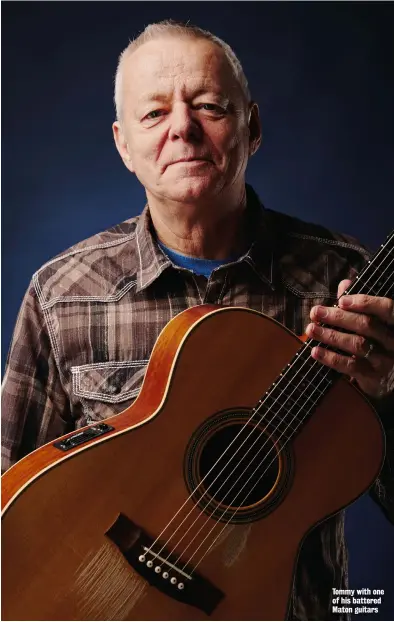  ??  ?? Tommy with one of his battered Maton guitars