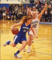  ?? STAN HUDY - SHUDY@DIGITALFIR­STMEDIA.COM ?? FILE - Saratoga Springs junior Kerry Flaherty looks to get past Shaker’s Lexi Ratigan Thursday night against Shaker High.