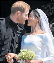  ??  ?? So happy... Harry and Meghan on their wedding day
