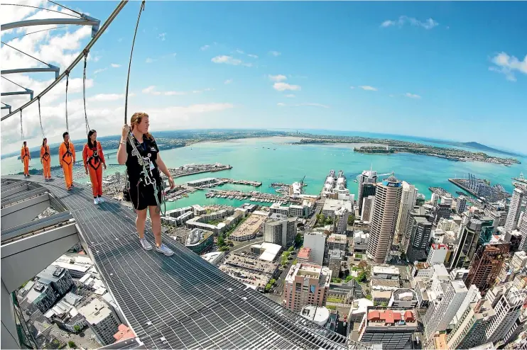  ?? PHOTOS: SUPPLIED ?? High on the Auckland Sky Tower’s SkyWalk, the views of the city are spectacula­r.