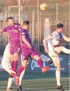  ??  ?? Near thing Andy Ryan (7) sees his header hit the bar as Declan Byrne challenges