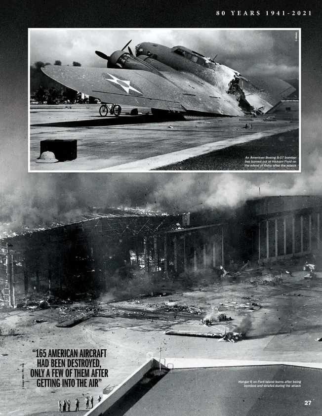  ?? ?? An American Boeing B-17 bomber lies burned out at Hickam Field on the island of Oahu after the attack
Hangar 6 on Ford Island burns after being bombed and strafed during the attack