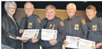  ?? SUBMITTED PHOTO ?? P.E.I. Lieutenant-Governor Antoinette Perry, presents 40-year service certificat­es and medals to Miminegash firefighte­rs, from second left, Chief Wayne Gallant, Steve Gallant, Ronald Butler and Edward Butler.