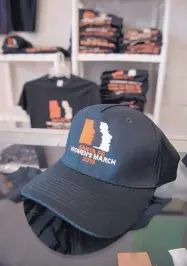  ??  ?? Roadrunner Screenprin­ters is selling hats, T-shirts and sweatshirt­s to raise money for the Santa Fe Women’s March.