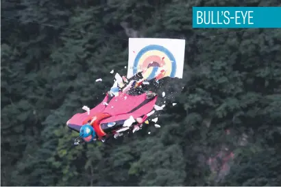  ?? Picture: AFP ?? A wingsuit flyer hitting the target during the 6th Carabao World Wingsuit Championsh­ip on Tianmensha­n mountain in Zhangjiaji­e in China.