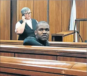  ?? Picture: KATHRYN KIMBERLEY ?? ICY STARE: Nqaba Charles sits in the dock after he was convicted of killing Constable Devin Hattingh on July 28 2014