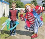  ??  ?? Dylan Callander meets Bubbles the clown.