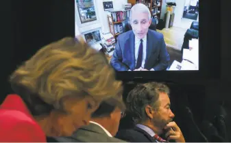  ?? Win McNamee / Associated Press ?? Senators listen as Dr. Anthony Fauci, director of the National Institute of Allergy and Infectious Diseases, speaks remotely during a virtual Senate hearing on Capitol Hill.