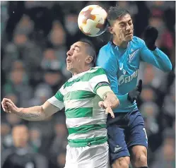  ?? Picture: PA. ?? Scott Brown challenges Zenit’s Emiliano Rigoni.