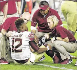  ?? WILFREDO LEE / ASSOCIATED PRESS ?? QB Deondre Francois was sacked 32 times this season and needed attention here in FSU’s victory at Miami, but he kept getting up.