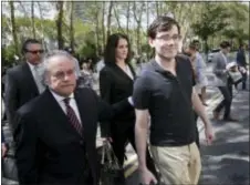  ?? SETH WENIG — THE ASSOCIATED PRESS ?? Martin Shkreli, right, and his attorney Benjamin Brafman, left, leave federal court in New York, Friday. The former pharmaceut­ical CEO has been convicted on federal charges he deceived investors in a pair of failed hedge funds. A Brooklyn jury...