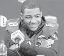  ?? STEPHEN M. DOWELL/ORLANDO SENTINEL ?? The smile is missing from UCF quarterbac­k Darriel Mack Jr.’s face these days as he must recover from a broken ankle.