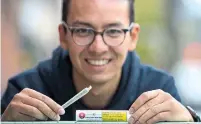  ?? RICK MADONIK TORONTO STAR ?? Brett Chang, 27, shows off the one pre-rolled joint he received in the mail from the Ontario Cannabis Store.