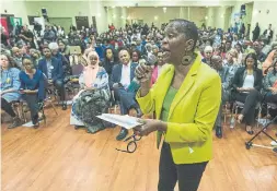  ?? RICK MADONIK TORONTO STAR FILE PHOTO ?? Jones was very involved in the community. Here she asks a question at a 2018 Ontario leadership debate at the Canadian Jamaican Associatio­n Centre.