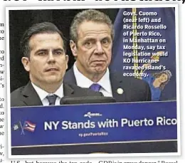  ??  ?? Govs. Cuomo (near left) and Ricardo Rossello of Puerto Rico, in Manhattan on Monday, say tax legislatio­n would KO hurricaner­avaged island’s economy.