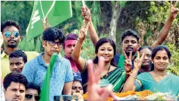  ??  ?? — PTI Jharkhand Mukti Morcha candidate Seema Mahato with her supporters flashes a victory sign during the victory procession after winning the Silli constituen­cy.