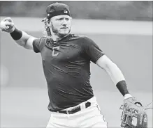  ?? DAVID DERMER THE ASSOCIATED PRESS ?? Cleveland Indians’ Josh Donaldson throws during a team workout. He is part of a strong free-agent class this year.