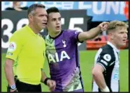  ?? ?? Saviours: Sergio Reguilon alerts Andre Marriner to the incident in the stands