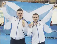  ??  ?? 0 Marc Austin with his unexpected bronze medal in the triathlon, Neil Fachie and Matt Rotherham take gold in the blind and visually impaired 1,000m time trial, and Hannah Miley celebrates her silver in the women’s 400m individual medley