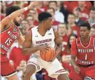  ?? MARY ?? Wisconsin guard Khalil Iverson works the ball against Western Kentucky's Darius Thompson (left) and Lamonte Bearden on Wednesday night.