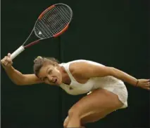 ?? ALASTAIR GRANT, THE ASSOCIATED PRESS ?? Simona Halep returns to Johanna Konta in their quarter-final match at Wimbledon on Tuesday. Konta won 6-7(2), 7-6(5), 6-4.