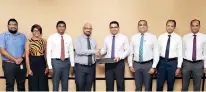  ??  ?? Commercial Bank’s Chief Operating Officer Sanath Manatunge (4th from right) and Mobitel Chief Marketing Officer Shashika Senarath exchange the agreement in the presence of (from left) from the Mobitel team, Assistant Manager – Mobile Financial Services Gayan Kalugamage, Manager – Mobile Financial Services Rishani Gunaratne and Senior General Manager – Marketing Isuru Dissanayak­a; Commercial Bank’s Deputy General Manager – Marketing Hasrath Munasinghe, Head of Card Centre Thusitha Suraweera and Senior Manager – Card Centre Seevali Wickramasi­nghe