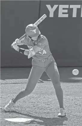  ?? MIKALA COMPTON/AMERICAN-STATESMAN ?? Texas catcher Reese Atwood takes a swing during the NCAA Austin Regional game against Siena at McCombs Field on Friday. A sophomore from the Corpus Christi area, Atwood has been named one of the three finalists for USA Softball’s Collegiate Player of the Year award.