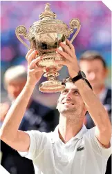  ?? / FOTO: AFP ?? Cuarto campeonato del serbio Djokovic en el torneo de Wimbledon.